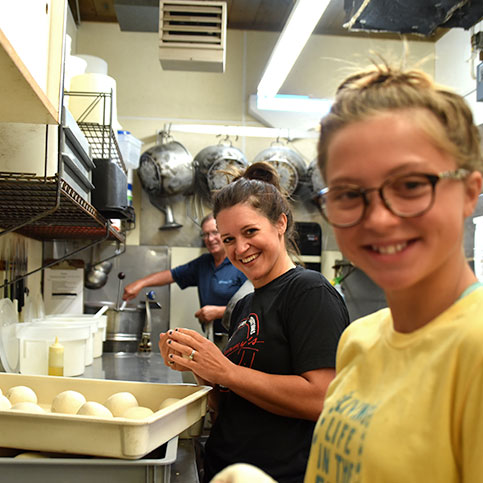 Family making pizza